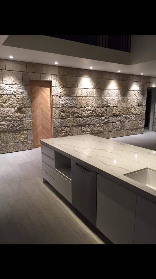 Kitchen stone wall with architectural downlights — Pether Electrical Central Coast